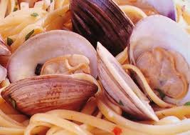 Whole clams in the shell over linguine