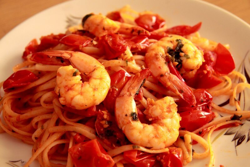 Shrimp and cherry tomatoes over linguine