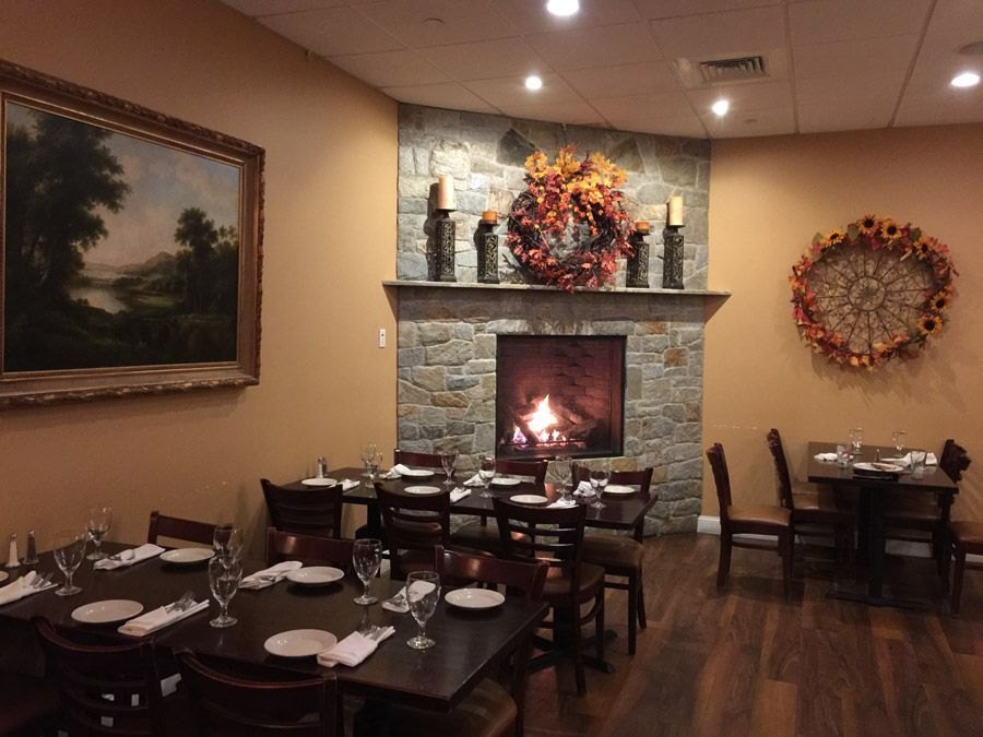 The Lorenzo’s dining room with a stone fireplace