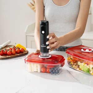 Wamoma handheld vacuum sealer on a food container